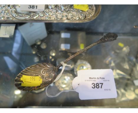 A decorative silver spoon by Mappin &amp; Webb