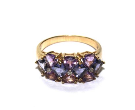 A 9 carat gold ring set with diamonds and amethyst