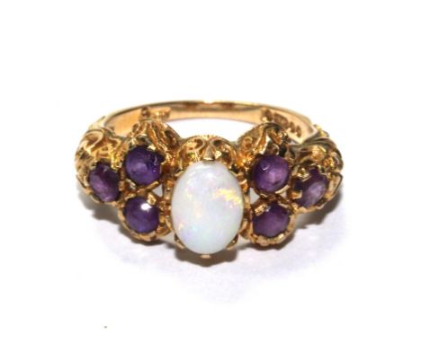 A 9 carat gold dress ring set with opal and amethyst