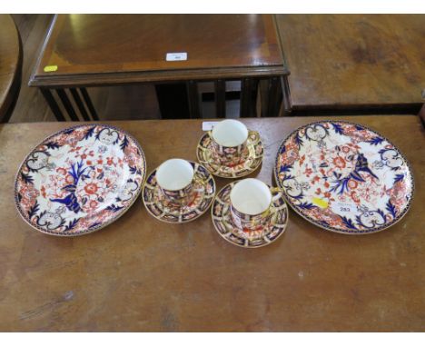 A pair of late Victorian Royal Crown Derby plates, with floral design in Imari colours, 22.5cm diameter, and three later coff