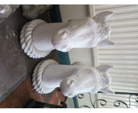 A pair of painted concrete architectural horses heads, 49cm high
