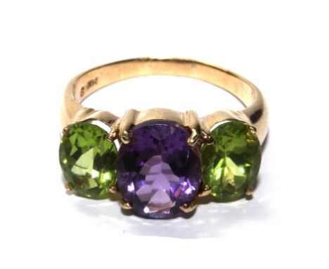 A 14 carat gold ring set with amethyst and peridot