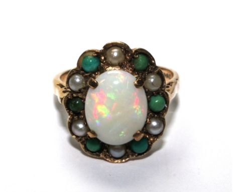 A 9 carat gold ring set with a central opal within a circle of alternating seed pearls and turquoise