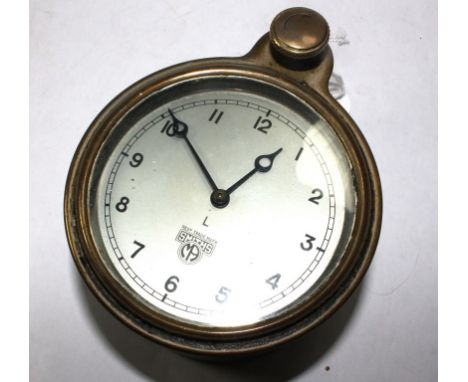 A Smiths car clock with silvered dial and winding knob, 9cm diameter