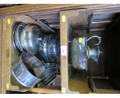 A collection of silver plate to include plates and covers