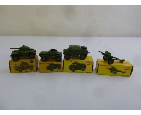 Four Dinky Military vehicles Armoured Car 670, Scout Car 673, Field Tractor 688 and Field 25 Pound Gun 686