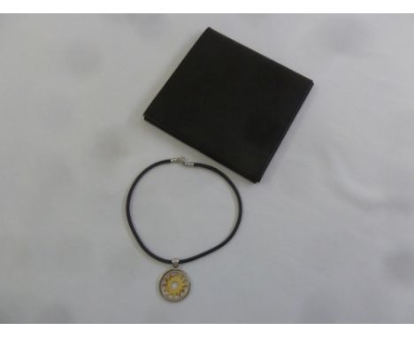 Bulgari 18ct gold star set in a steel ring with leather necklace in original leather pouch