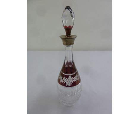 A ruby flash cut glass decanter with drop stopper and silver collar