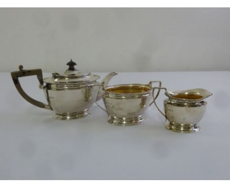 A silver three piece teaset, shaped oval, gadrooned borders, London 1922 (the teapot 1921) by D and J Welby