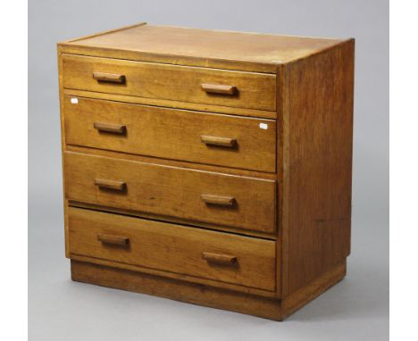 A mid-20th century light oak small chest fitted four long graduated drawers with block handles, &amp; on plinth base, 29¾” wi