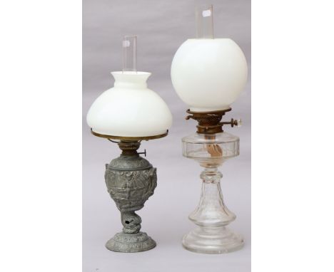 A late Victorian clear glass oil lamp with faceted flared stem; &amp; a speltre oil lamp; each with opalescent glass shade, 2