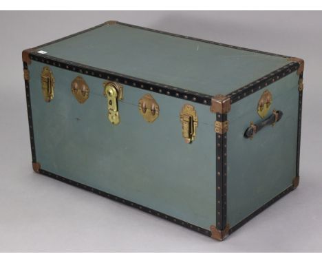 A mid-20th century blue fibre covered &amp; steel studded travelling trunk with hinged lift-lid, 36” wide x 19¾” high x 19¾” 