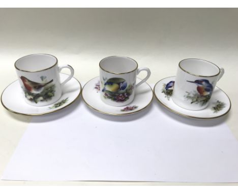 A collection of 6 Royal Worcester cups and saucers decorated with birds.