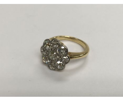 A quality old cut diamond cluster ring, approx g and approx size I.