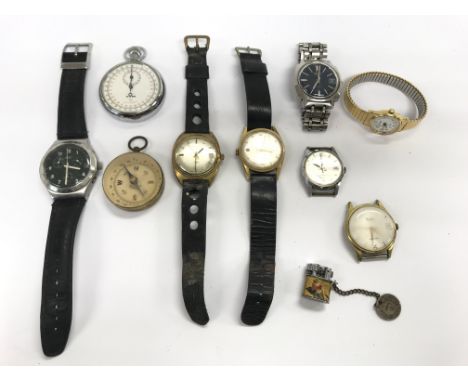 A collection of used watches, a compass and stopwatch.