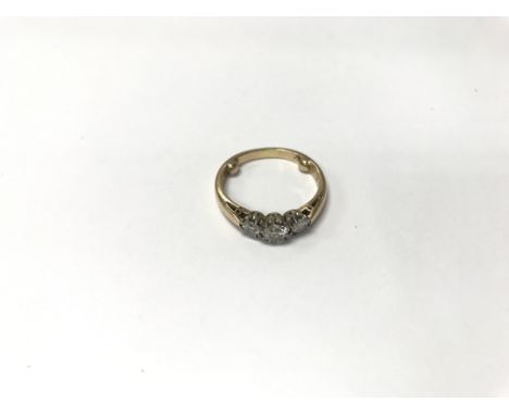 An 18ct gold three stone ring. Weight approx 4.6g, size approx N