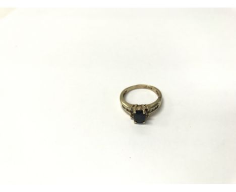 A blue sapphire and diamond (one missing) ring. Weight approx 4g, size approx N/O