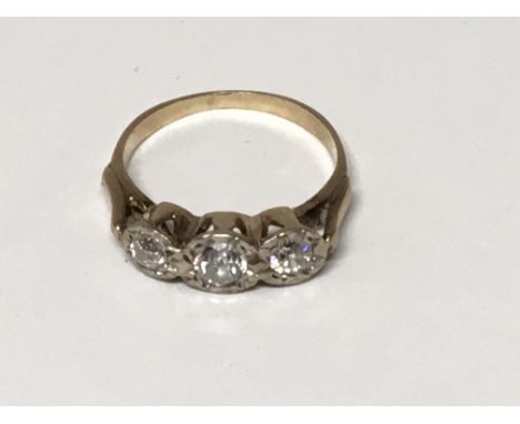 An 18 carat yellow gold ring set with three old cut diamonds.ring size L.