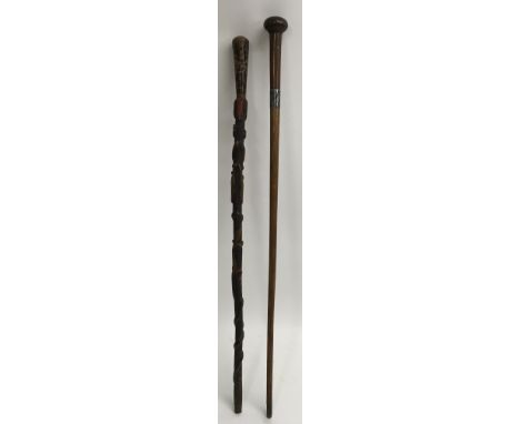 An unusual walking stick having faux tortoishell handle carved with insects, possibly African, plus a silver mounted walking 