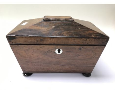A 19th century rosewood tea caddy.