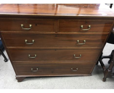 An Edwardian inlaid Mahogany and satinwood banded chest of drawers.Fitted with two short and three long drawers, with bracket