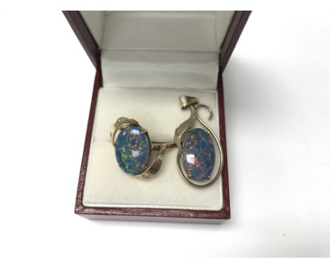 An opal ring and 9ct gold pendant.