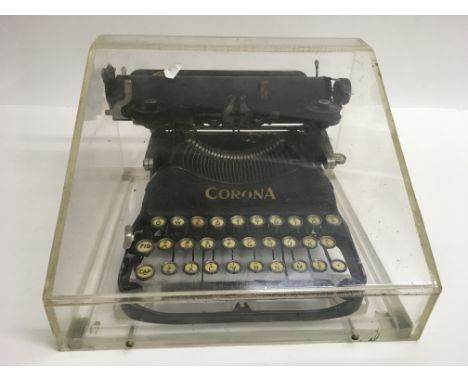 A vintage miniature Corona typewriter in Perspex case, approx 27.5x30cm