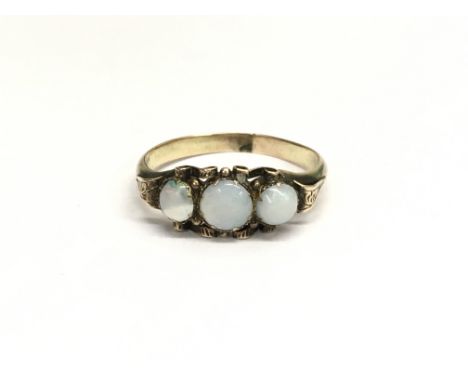 A Victorian gold ring set with three opals. Ring size N/M, total weight approximately 1.5 grams.