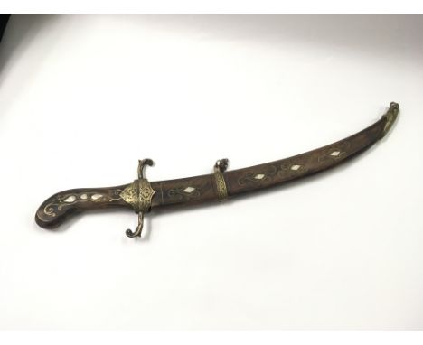 An old Turkish knife or small sword with wooden hilt and scabbard, all inlaid with brasswork and mother of pearl