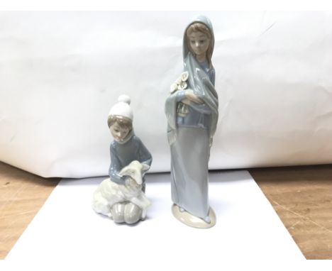 A Lladro figure of a girl and a shepherd boy.