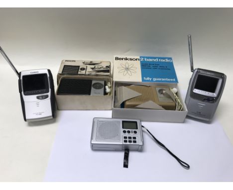 A pair of boxed 1960's transistor radios with instructions and a digital radio together with a pair of Casio pocket TV's (wor