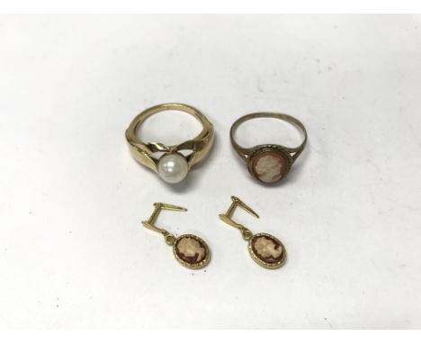 A pearl ring, cameo ring and matching earrings.