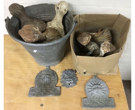 A collection of cast iron feet for enamel baths etc
