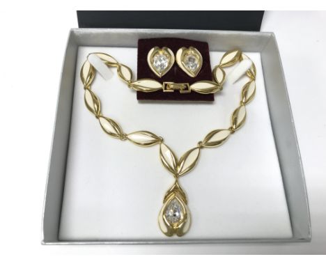 A box cream enamel and diamonte necklace and earring set.