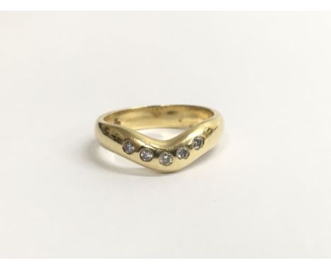 A ladies 18ct yellow gold wishbone ring, set with a row of five diamonds. Total weight approximately 4.2 grams, rings size ap