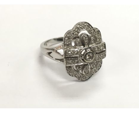 An Art Deco 9ct white gold and diamond ring, approx 5.2g and approx size O.