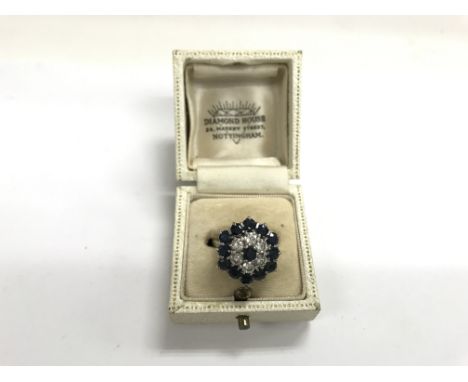 A quality 18ct white gold ring set with diamonds and blue sapphires. Weight approx 7g, size approx K/L