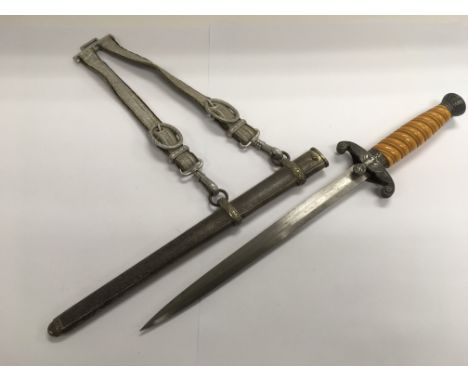 A Third Reich dagger and scabbard.