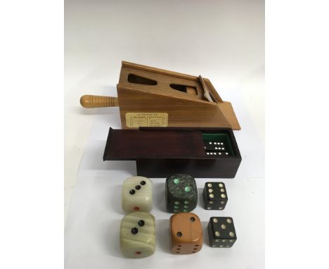 A group of vintage table gaming items comprising a 'Le Banquier' card shoe, onyx and stone dicei and a box of dominoes