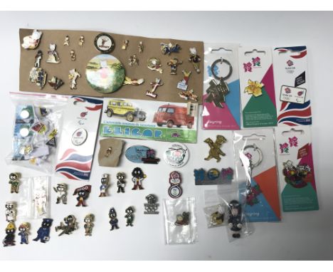 A collection of enamel badges of Rupert The Bear, London 2012 and Gollys together with some other oddments.