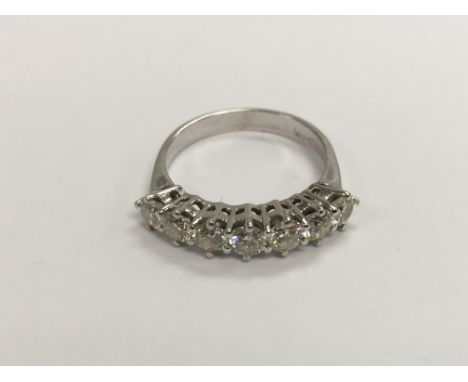 A seven stone diamond white gold ring, marked 750, approx 3.4g and approx size O-P.