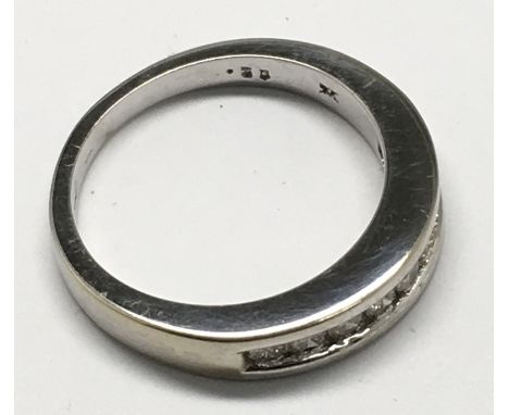 A 9ct white gold diamond band ring, stamped.35.Approx N/M