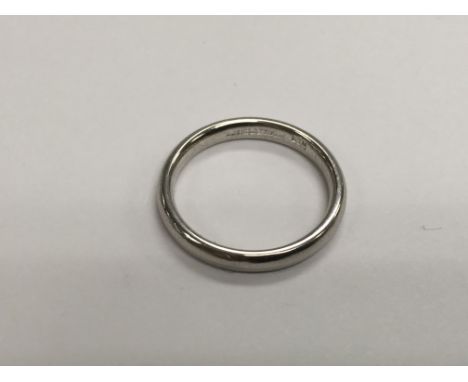 A platinum ring marked 970, approx 4.5g and approx size K.