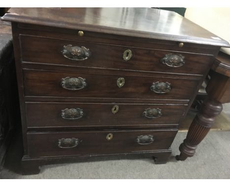 A Georgian mahogany chest of drawers fitted with brushing slide four drawers on bracket feet 82 cm by 79