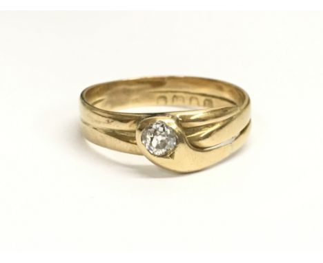 A Victorian 18ct gold and diamond snake ring, set with one stone. Ring size approximately W/V, weight approx 4.2 grams.