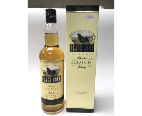 A bottle of 'Black Cock' deluxe blended Scotch whiskey. 