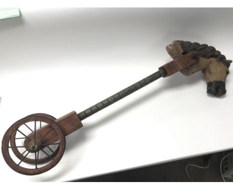 A carved wood and painted Victorian style hobby/stick horse. Length approx