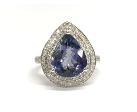 A 14ct white gold and diamond ring set with a pear cut Tanzanite approx 4.45ct. Diamonds approx 0.75ct total weight. Ring siz