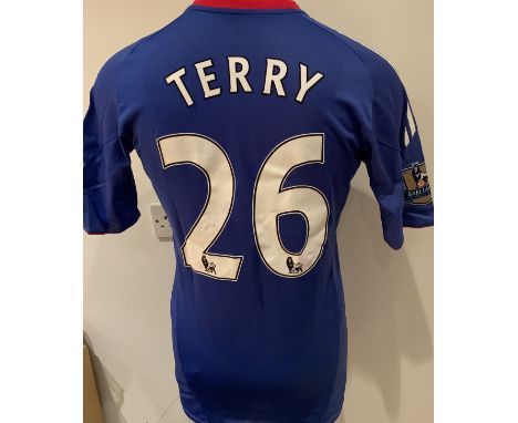 Chelsea 2010 - 2011 Match Worn Football Shirt: Blue short sleeve shirt with Gold Premier League Champions badges to sleeves. 