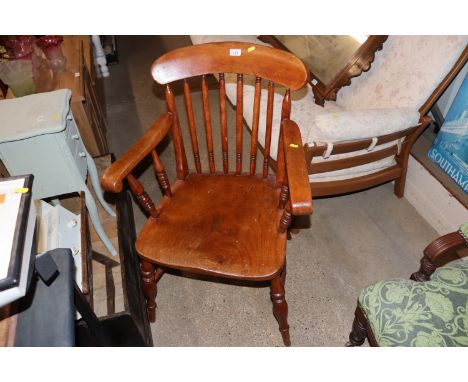 An elm seated stick back elbow chair
